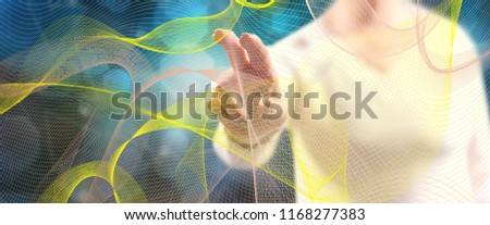 Woman touching an abstract wave network concept on a touch screen with her fingers