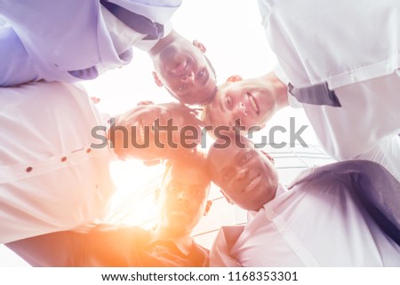 close up hands of group of multinational people businesswoman and business man at a business meeting handshake . teamwork concept