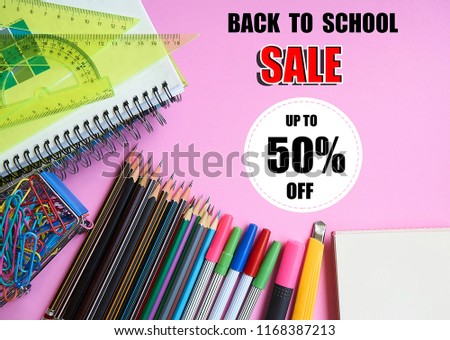 Back to school sale with school supplies on pink background with copy space. Education