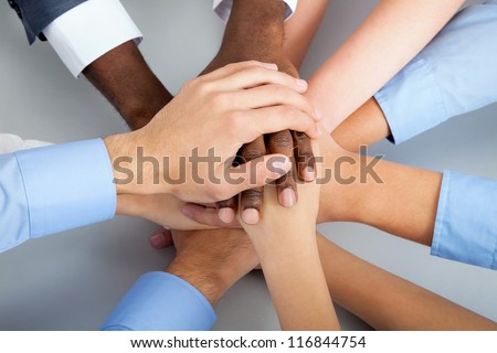 International  business team showing unity with their hands together Royalty-Free Stock Photo #116844754