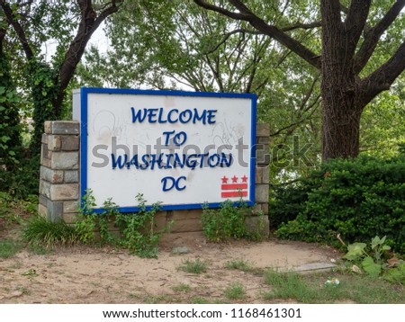 Washington DC welcome sign sitting between Arlington and Georgetown