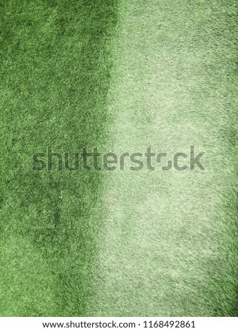 Abstract close up top view green color of artificial grass background texture made width dark border filters. 