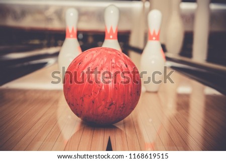 The bowling ball is ready to strike
