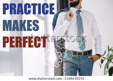 cropped view of businessman standing near window with "practice makes perfect" lettering and gears