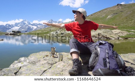 Smiling Active Young Man in Outdoors The Mountains