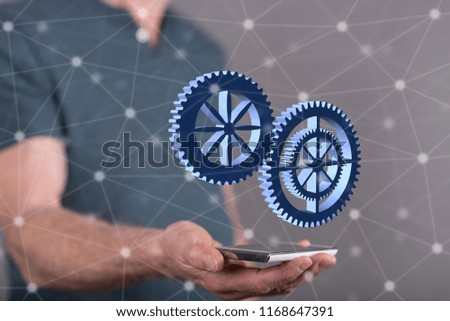 Teamwork concept above a smartphone held by a man in background