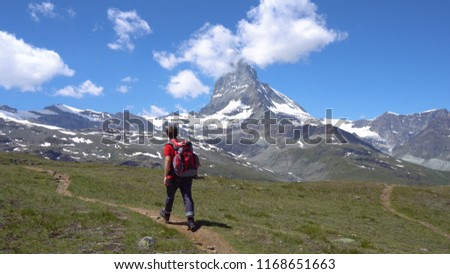 Young Hiker in Alpine Mountains with Room For Text