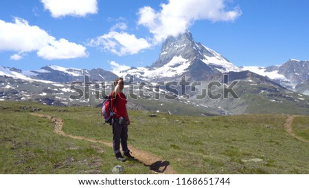 Young Hiker in Swiss Mountains with View of Iconic Matterhorn