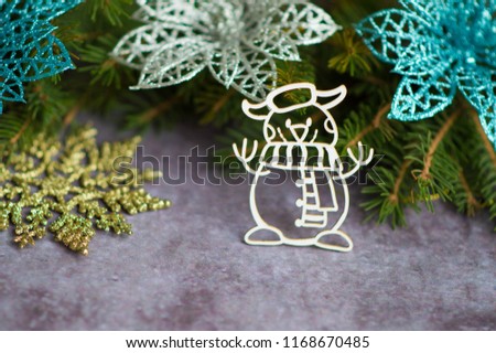 Christmas snowman with Christmas tree branches and Christmas poinsettia flower border background with snowflakes isolated on concrete background. Christmas background screensaver
