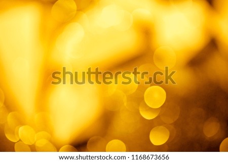 golden festive bokeh on black background 
