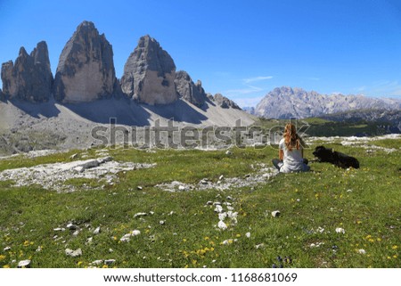 Women enjoy the view with dogs 