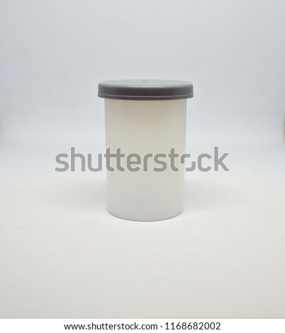 A film container with grey lid with isolated white background