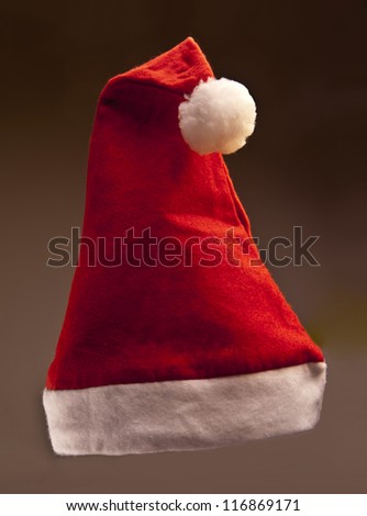 Single Santa Claus red hat on black background
