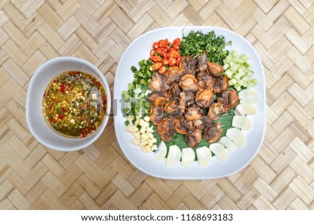 Ingredients of Spicy Cockle with Lemon grass Lemon juice and chili star, fresh garlic scallops,red chili, fresh onion,  fresh ginger,coriander,young mango,Thai food. Thailand styles.
