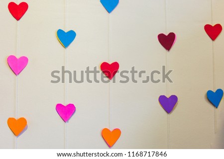 Colorful hanging hearts on the white background,heart sign background