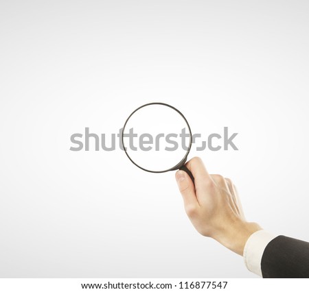 lens in hand  on a white background