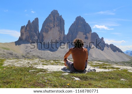 Man enjoying a view from top of the mountain