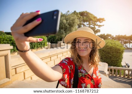 Pretty tourist girl taking selfie in park in Baku, Azerbaijan