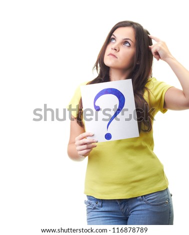Attractive young woman in a yellow shirt holding a a poster with a question mark and looks the upper-right corner. Isolated on white background