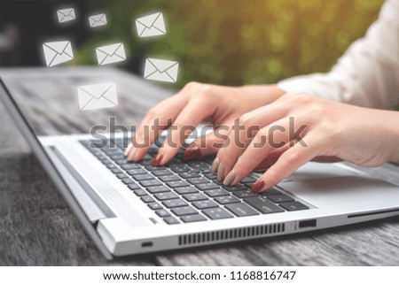 Business woman using Laptop pc to send e- mail with email icon, E-mail and communication concept.