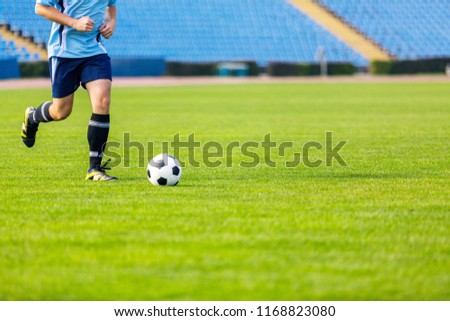Running soccer player. Soccer football background.