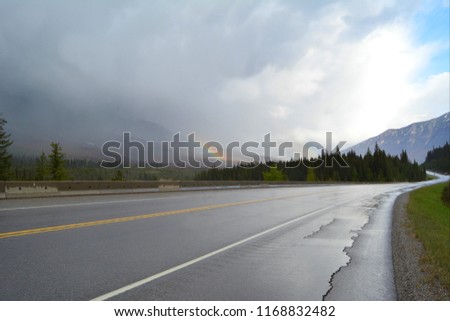Stunning road in misty weather with rainbow - Awesome background picture - Canada