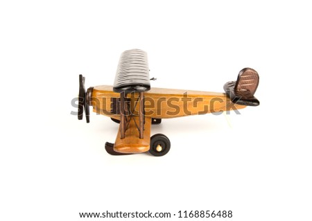Wooden toy airplane isolated on a white background
