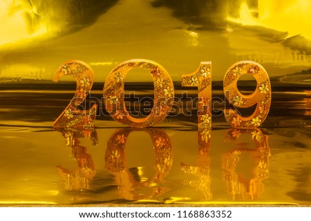 2019 is made in gold color place in golden background is mean the golden year for lucky all year