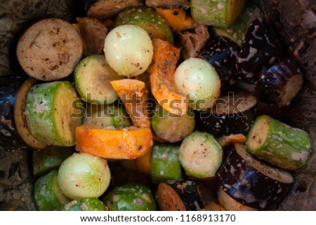Vegetables (zucchini, eggplant, onion and pumpkin) are in a saucepan