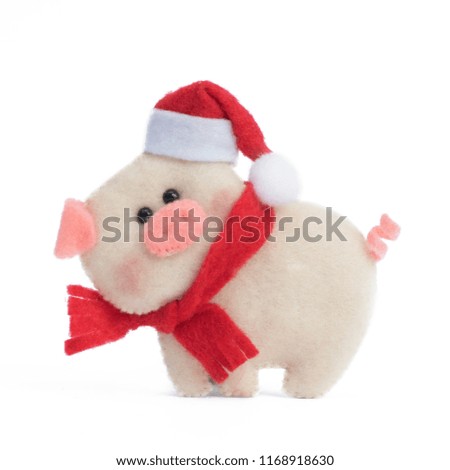 
Pig handmade from felt on a white isolated background