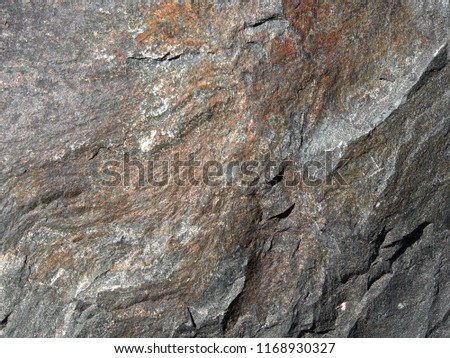 Stone slab, granite, basalt, sandstone, gray and colored as a background - detail shot
