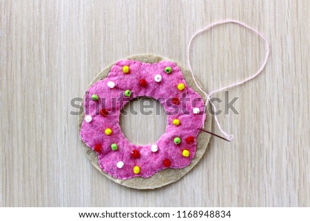 Cool donut step by step. Handmade for girl, boy and children. Step 12. Sew pink circle from all sides.