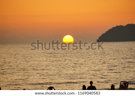 Visitor enjoying sunset in Tanjung Aru Beach,Kota Kinabalu,Sabah.(Silhouette photo)