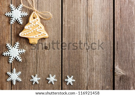 Christmas homemade gingerbread cookies over wooden table