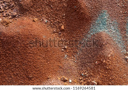Red earth or soil background. Tropical laterite soil  background of red clay. Dry Orange surface, Picture of natural disaster. Drought land Caused by global warming and deforestation.