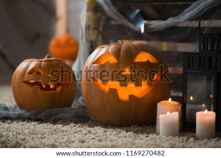 Background of the Pumpkin Spiders candles and other attributes of the autumn holiday Happy Halloween