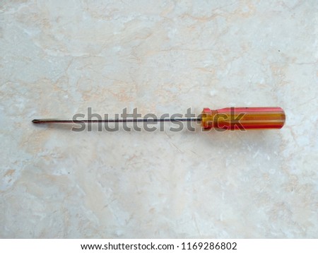 red yellow screwdriver with many functions