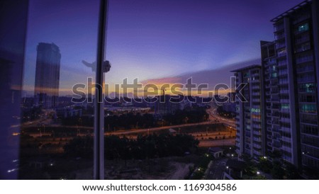 A beautiful sunset with spiking sun ray view from a window 