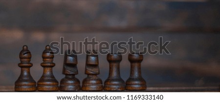 chess pieces on a dark background