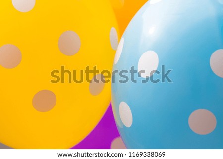 Background of orange, blue and purple balloons with the white circles on them. The optimistic picture, the symbol of happiness and joy
