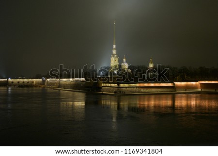 Peter and Paul Fortress and Cathedral In Saint Petersburg, Russia at Night on the River Neva