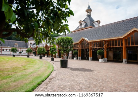 Typical traditional architecture based on the chalet or craft style at the former royal palace 'Het Loo' in Apeldoorn, the Netherlands