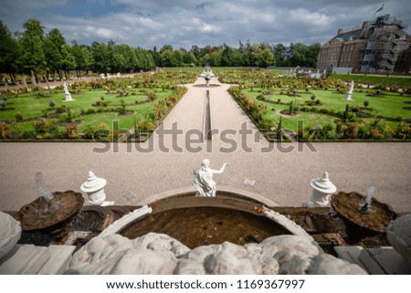 Royal Dutch palace garden with a view from the roof of the palace. Composite me perspective and sunny view over landscaped garden and fountains