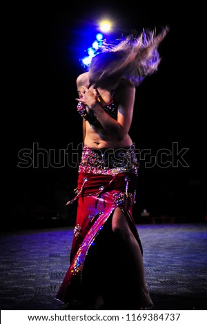 Belly dancing in the middle of the Desert Safari at Dubai. Royalty-Free Stock Photo #1169384737
