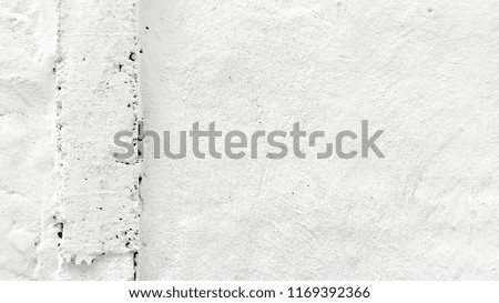White and gray stucco painted wall texture detail.