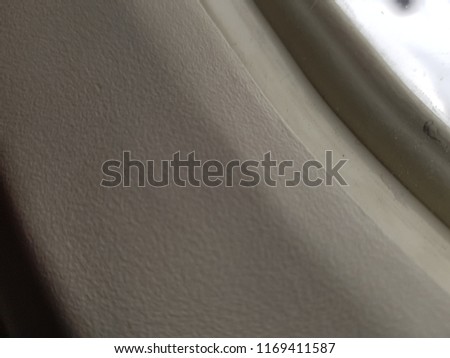 airplane window frame close up photo