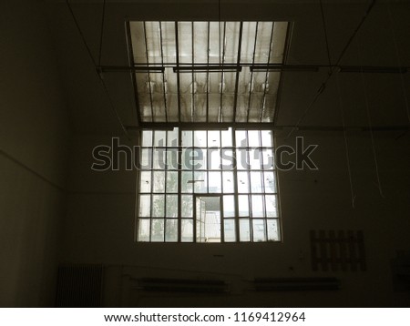 A window in an industrial  ruin