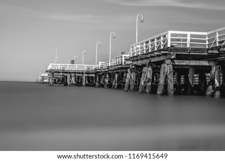 Monochrome abstract landscape. Wooden pier on Lake . Long exposure. Black and white Photo.