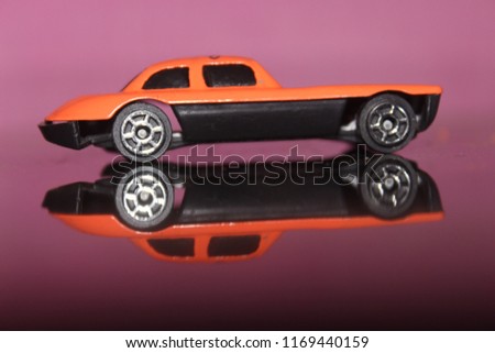 small toy car orange colr