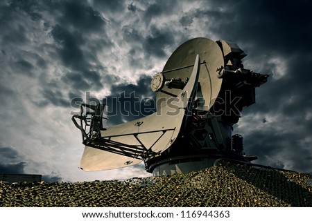 Air defence radar over dramatic night sky. Royalty-Free Stock Photo #116944363